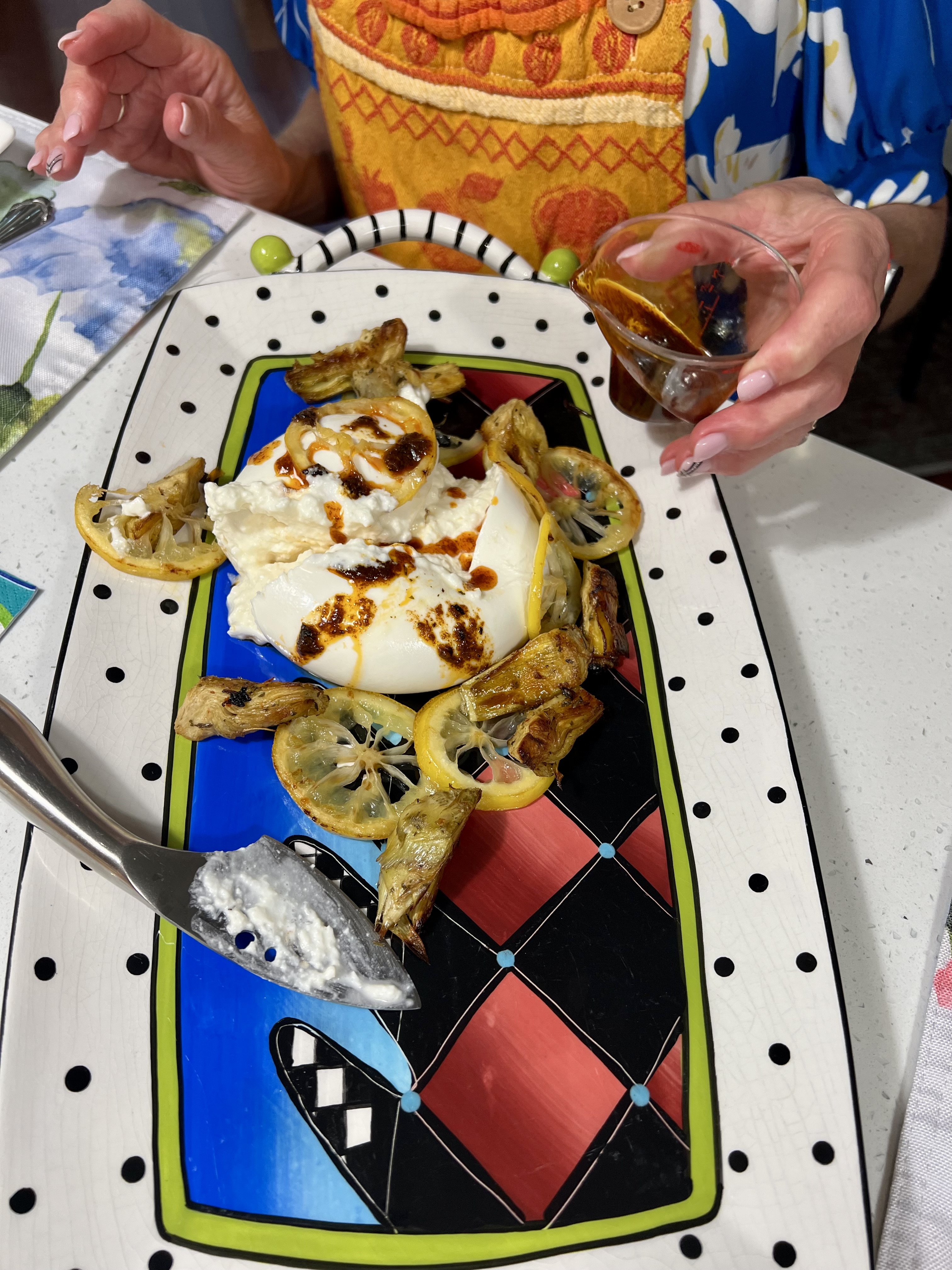 Burrata with Harissa Oil, Lemon and Crispy Artichokes